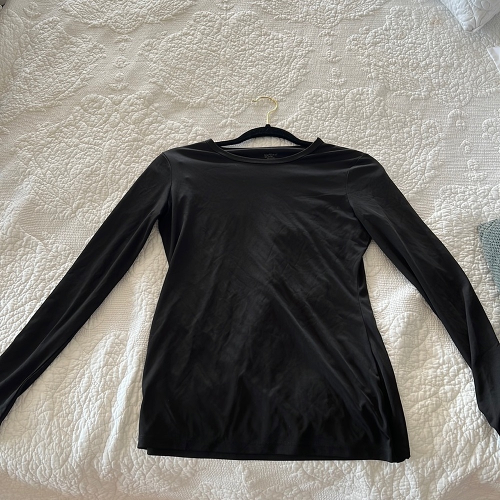 Black long sleeve shirt. 100% polyester.